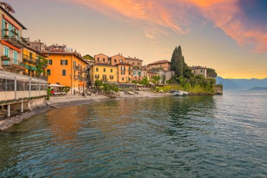 Varenna, Italy - May 2, 2018: View of Varenna village of Lake Como in the evening. Lake Como - a very popular tourist attraction. Varenna, Lombardy, Italy. clipart
