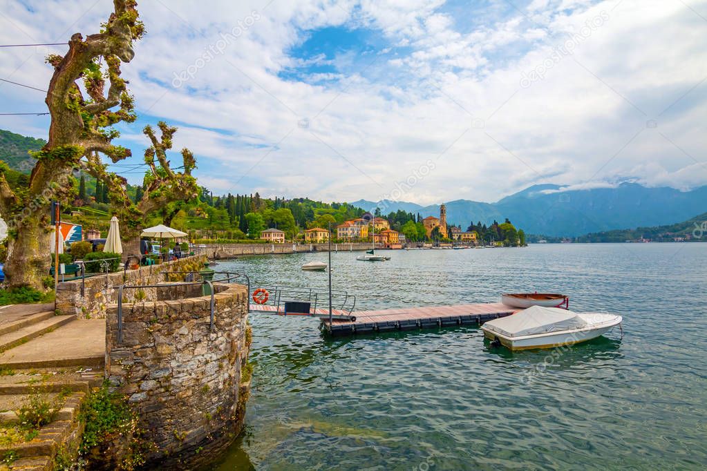 holidays in Italy - a view of the most  beautiful lake in Italy, Varenna, Lago di Como. Famous city of Tremezzina in background