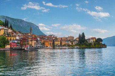 Lakefront of Varenna village seen from ferry departs Lake Como to Bellagio in Italy clipart