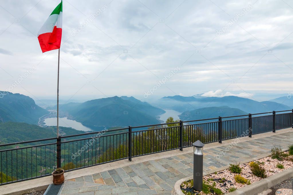 Balcony of Italy - Panorama of Lake Lugano in cloudy day. Alps with Mount blanc in background. Lombardia, Italy