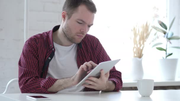 Young Man Browsing Scrolling Tablet — Stok Video