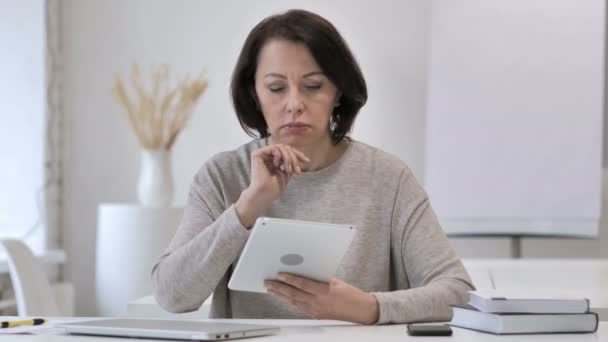 Pensive Old Senior Woman Thinking While Using Tablet — Stock Video