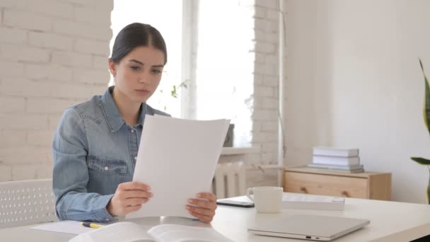 Young Girl Reading Papers Contract — Stock Video