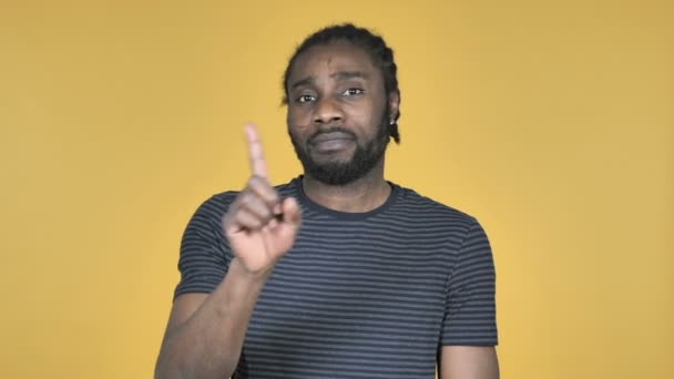 Casual African Man Waving Finger Refuse Isolated Yellow Background — Stock Video