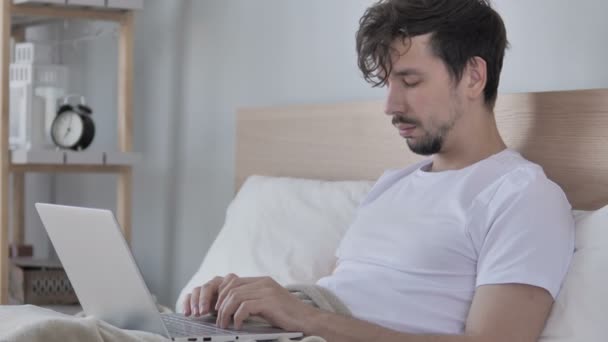 Casual Young Man Sleeping While Using Laptop Bed Home — Stock Video