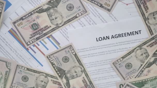 Scattered Dollars on Loan Agreement on Desk — Stock Video