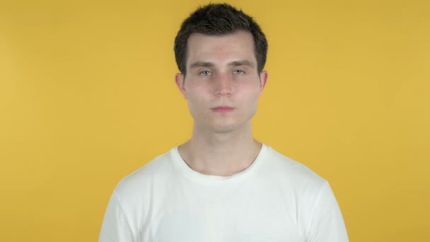 Rejecting Young Man Disliking Offer Isolated on Yellow Background — Stock Video