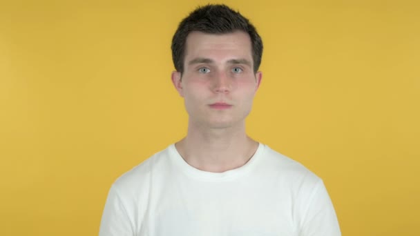 Young Man Showing Middle Finger Isolated on Yellow Background — Stock Video