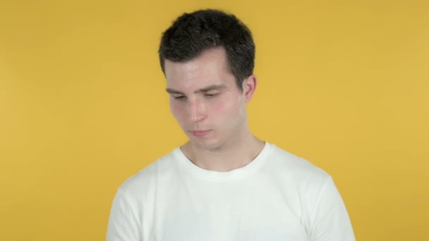 Young Man Talking on Smartphone Isolated on Yellow Background — Stock Video