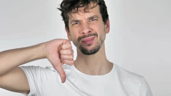 Retrato de un joven trastornado Casual Gesturing Thumbs Down — Foto de Stock