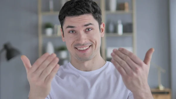 Inviting Gesture by Young Man at Workplace — Stock Photo, Image