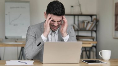 Headache, Tired Businessman Working on Laptop clipart