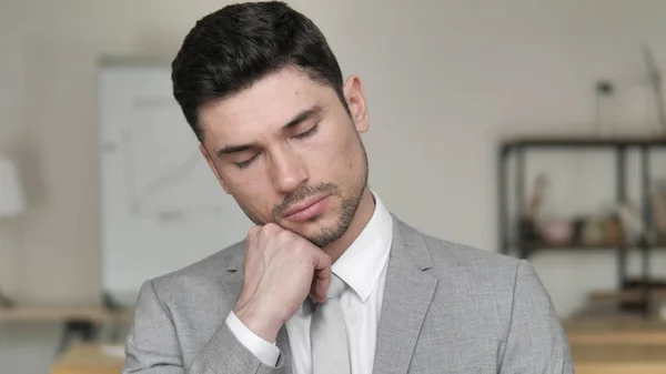 Tired Businessman Sleeping at Work