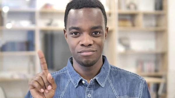 No by Young African Man, Waving Finger to Reject