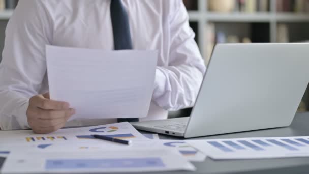 Close Up Shoot of Businessman using Laptop and Documents — Stock video