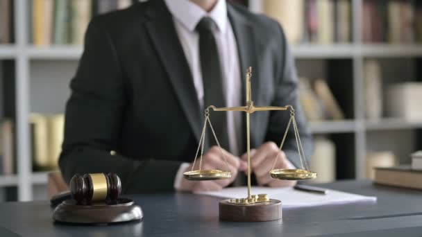 Close Up of Balance Scale and Gravel on Table with Lawyer — Stock video