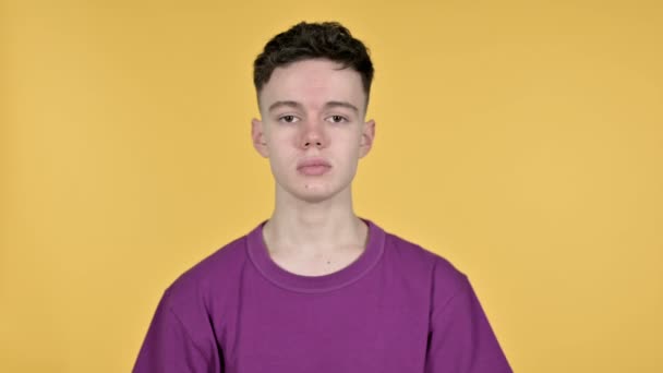 Victory Sign by Young Man on Yellow Background — Stock video