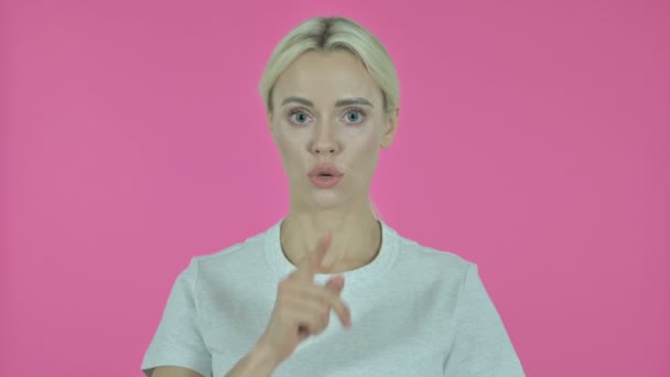 Young Woman Gesturing Silence by Finger on Lips — Stock Video