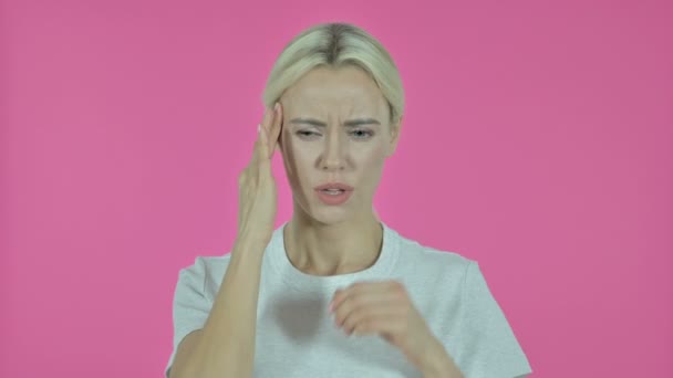 Young Woman with Headache on Pink Background — Stock Video