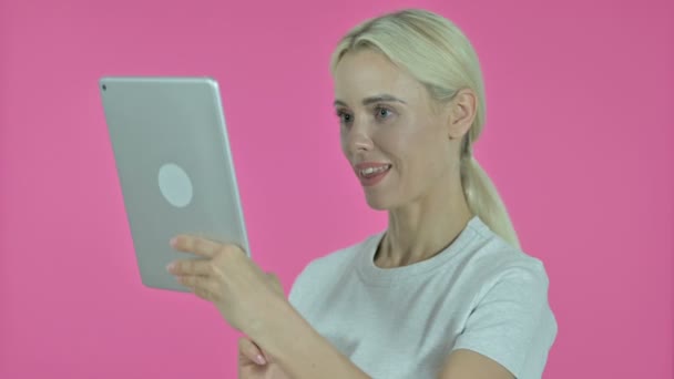 Video Chat on Tablet by Young Woman, on Pink Background — Stock Video