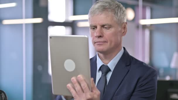 Portrait of Middle Aged Businessman using Tablet — Stock Video