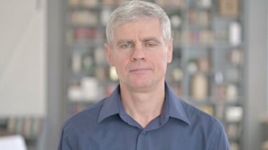 Portrait of Cheerful Man showing Thumbs Up