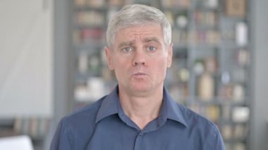 Portrait of Shocked Man getting Upset in Office