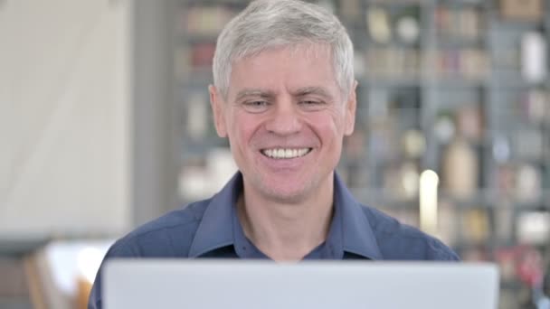 Portrait of Cheerful Middle Aged Man doing Video Chat on Laptop — Stock Video