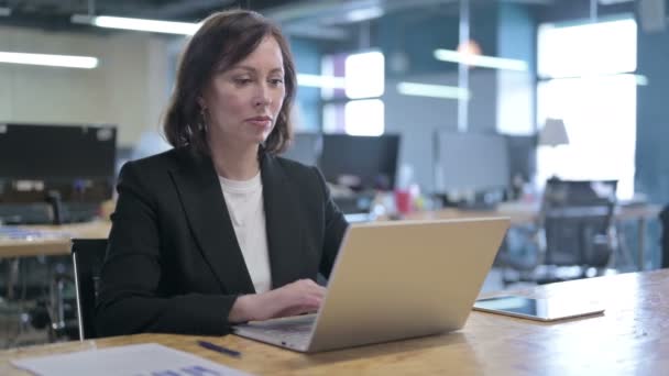 Serious Middle Aged Businesswoman Standing up and Going Away from Laptop — Stock Video