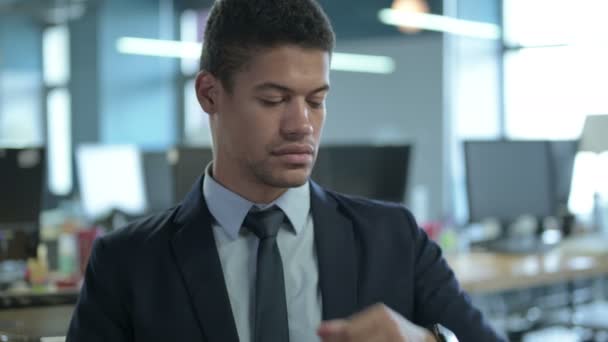 Portrait of African Businessman using Smart Watch in Office — стокове відео