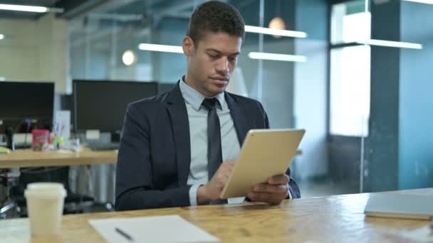 Sad Young African Businessman having Loss on Tablet — Stock Video