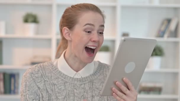 Portrait of Young Woman Celebrating Success on Tablet — Stock Video