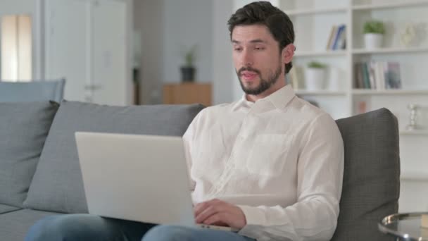 Cheerful Young Businessman doing Video Chat on Laptop at Home — Stock Video