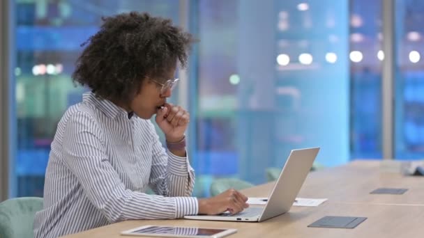 Sick African Businesswoman with Laptop Coughing in Office — Stock Video