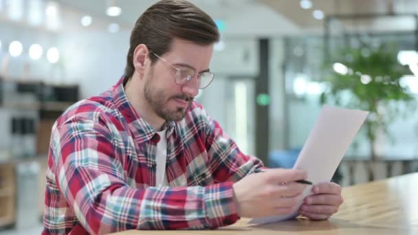 Hardworking Male Designer Reading Documents — Stock video