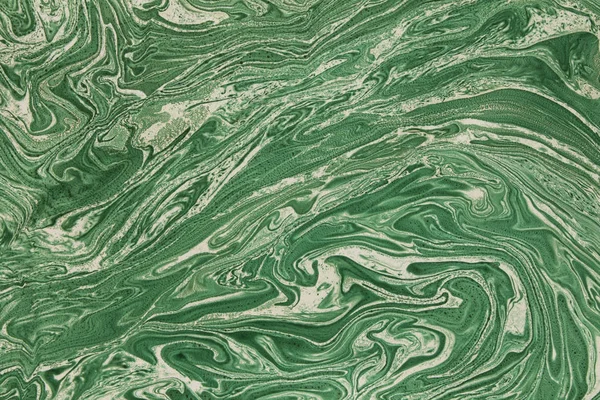 Bulanık yeşil arka plan öğeleri yeşil boya yaymak ve mermer doku etkisi ile