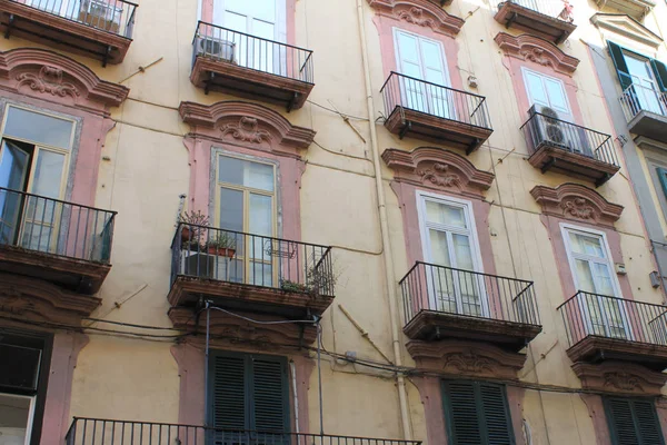 Traditional facade of European architecture with windows and balconies