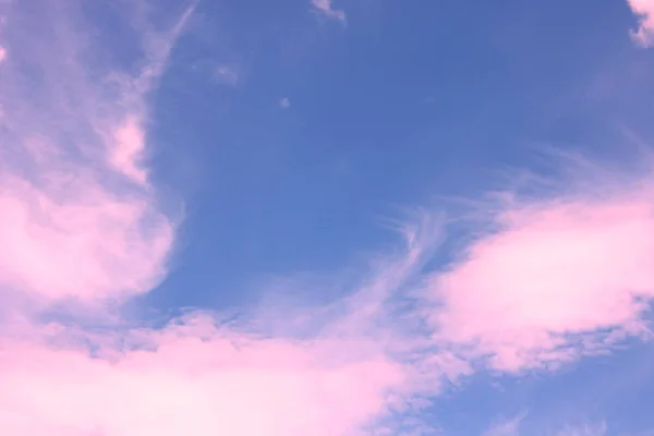Abstract photo with purple clouds on background of sky