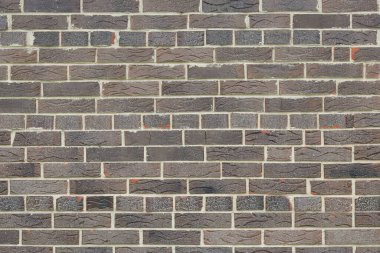 Güzel, alışılmadık tuğlaların kahverengi arka planı