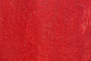 Yüzeyi pürüzlü eski kırmızı boyalı güzel bir klasik arka plan, eski pürüzlü yüzeyde kırmızı boya izleri ve pürüzlü dokuları var.