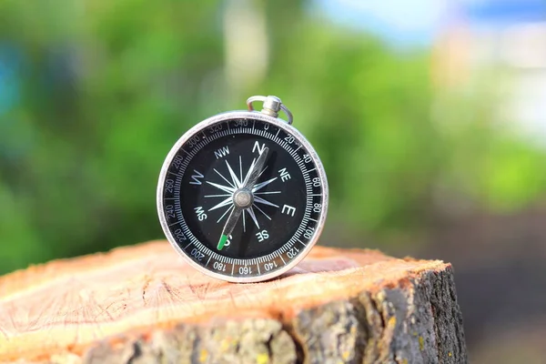 Old compass on natural background