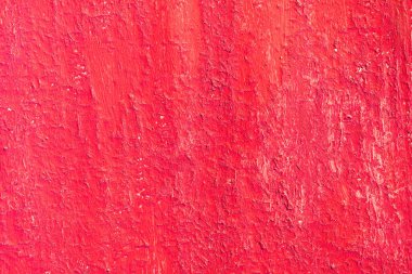 Yüzeyi pürüzlü eski kırmızı boyalı güzel bir klasik arka plan, eski pürüzlü yüzeyde kırmızı boya izleri ve pürüzlü dokuları var.