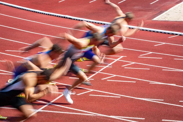 Blurred start of runners in sprint — Stock Photo, Image