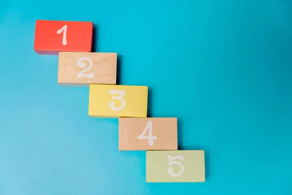 colored cubes with numbers on a blue background