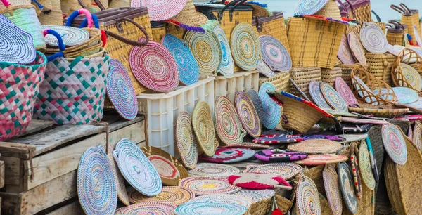 Craft wicker hats, bags and other souvenirs in Morocco market