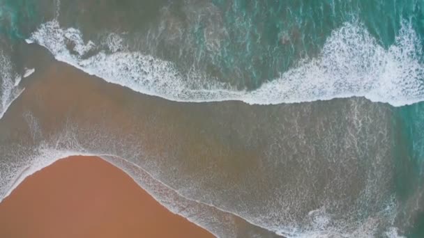 4k Aerial view of sea waves break on yellow sand beach — Stock Video