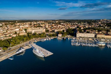 City of Pula aerial view from above the sea by a professional drones, Istria, Croatia. clipart