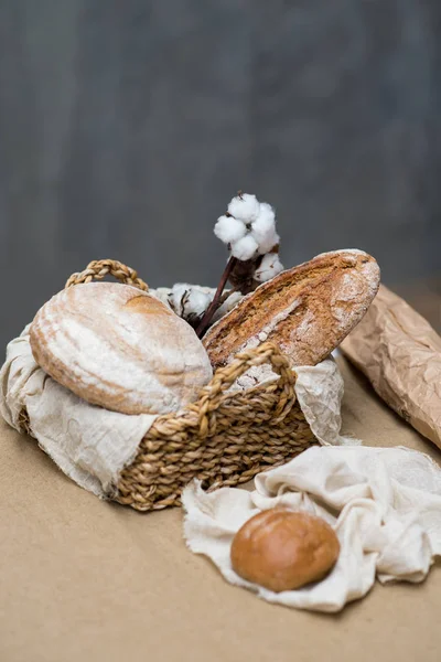 Composition with variety of baking products in the basket on the table