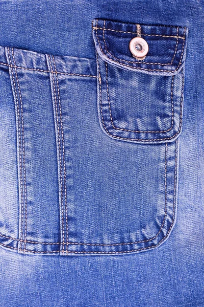 Pocket on denim overalls close-up. Comfortable denim pockets. Thoughtful comforts on jeans