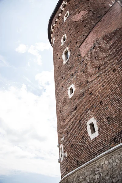 Large brick tower with windows. An ancient tower in old town. Krakow, Poland